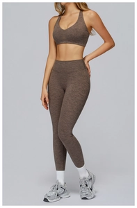 Detail of high-waist yoga set in heathered brown with textured athletic compression fabric