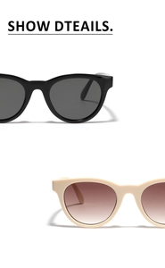 Detail view of vintage cat-eye sunglasses in black and cream with gradient lenses