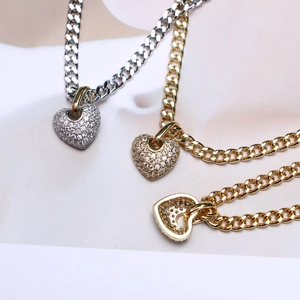 Golden and silver heart pendant necklaces with micro-paved zircons on cuban chains