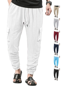 Detail view of cargo pants showing drawstring waist and vertical fabric texture