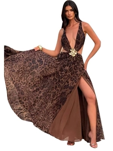 Detailed view of leopard print maxi dress with deep V-neck and golden flower ornament