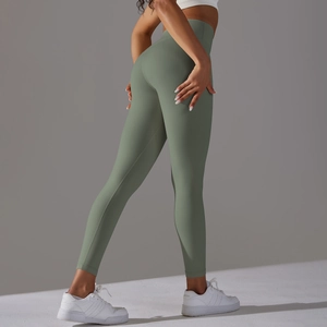 Close-up of sage green high waist leggings showing seamless texture and peach lift effect