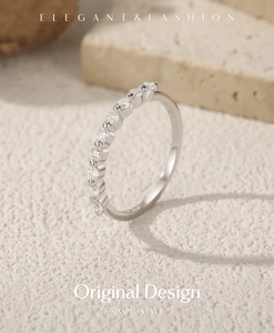 Macro shot of VVS1 moissanite S925 silver ring on a stone base with elegant engraving