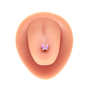 Pink butterfly tongue ring in enamel finish on realistic silicone tongue model