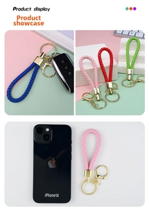 Detail of colorful braided leather keychains with golden hardware for car keys