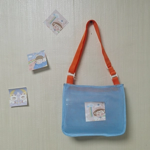 Blue mesh beach bag for kids with orange adjustable strap and cartoon card pocket