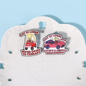 Two funny enamel pins featuring red and pink cars with witty mental health quotes