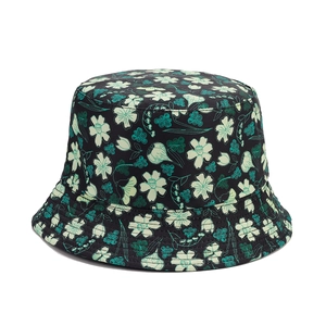 Floral reversible sun hat with lily and tulip print on a black canvas fisherman hat