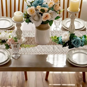 Bohemian hand-woven table runner with geometric diamond patterns and tassel details