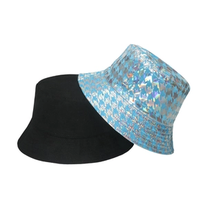 Detail of classic black bucket hat and light blue holographic houndstooth pattern texture