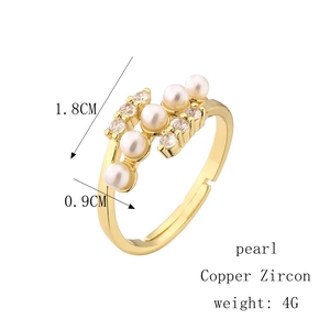 Golden open ring for women with white pearl and sparkling zircon in a 45-degree angle view