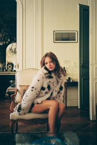 Detailed texture of black and white animal print faux fur jacket for women in vintage style