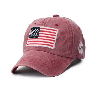 Detailed close-up of vintage washed cotton baseball cap with American flag embroidery