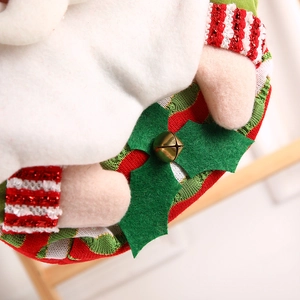 Christmas cartoon character gift bag with striped knit fabric and golden bell detail