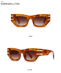 Détail de lunettes de soleil œil de chat écaillé avec verres dégradés et accents dorés