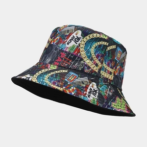 Detail of hip-hop bucket hat featuring retro graffiti, cassette tapes, and gold chains