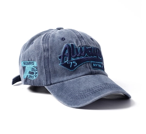 Detail shot of vintage washed blue cotton baseball cap with 3D letter embroidery