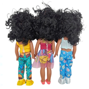 Rear view of African dolls with curly black hair wearing colorful outfits and dresses
