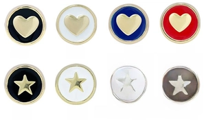 Close-up of colorful enamel heart and star shaped copper charm pendants with gold plating