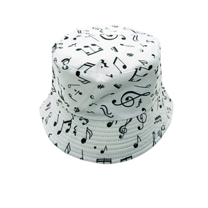 Close-up of white bucket hat featuring musical notes pattern and reinforced stitching