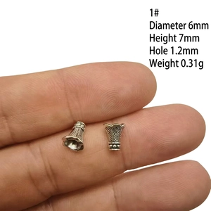 Detailed view of silver alloy bead cap with 6mm diameter and 1.2mm hole size