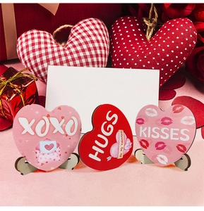 Three-piece heart-shaped wooden signs with XOXO and HUGS prints for Valentine's Day decor