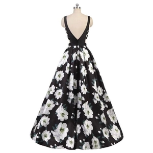 Elegant V-neck backless evening gown with black bodice and large white floral print A-line skirt
