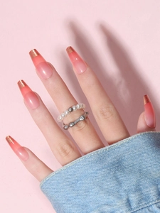 Faux ongles press on dégradés français longs cercueil avec ombre rose et feuilles d'or
