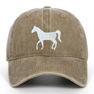 Macro shot of white horse embroidery on washed cotton vintage baseball cap texture