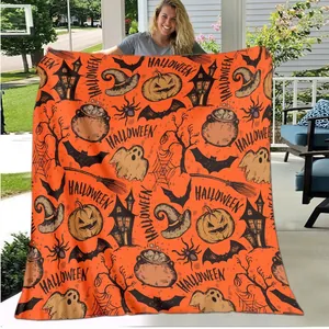 Orange Halloween flannel blanket featuring pumpkin, ghost and bat digital prints