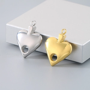 Macro view of gold and silver hollow heart pendants for DIY jewelry crafting