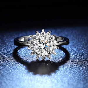 Macro shot of 1 carat sunflower-shaped moissanite ring with halo cluster on silver band