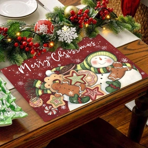 Christmas placemat with snowman and gingerbread man pattern on festive wooden table decor