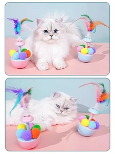 Detail of colorful feather and plush ball tumbler cat toy with a round blue base
