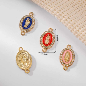 Oval religious enamel charms in gold, blue, red, and pink with sparkling crystal borders