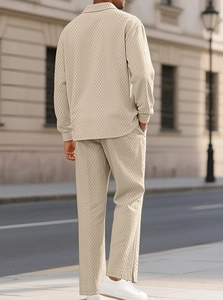 Detail of men's knitted polo set in beige featuring textured diamond pattern from behind