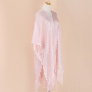 Detail showing pink shimmering knit shawl texture with elegant long fringe tassels