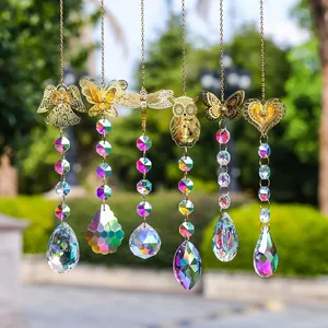 Golden garden wind chimes with crystals in diverse shapes like owl and butterfly