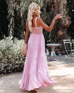 Detail of pink vertical striped maxi dress with smocking and tiered skirt
