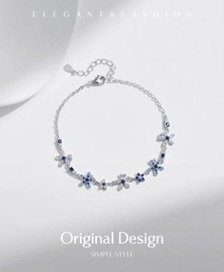 Detail view of S925 sterling silver flower bracelet with blue and white zircons