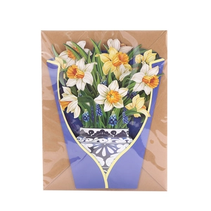 Detailed top view of 3D pop-up greeting card with white and yellow narcissus flowers