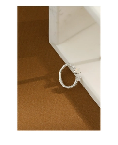 Detailed macro view of S925 sterling silver ring with opal and shimmering stone texture