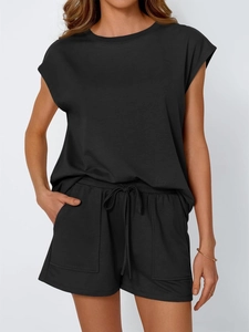 Close-up of black sleeveless cotton lounge set with drawstring shorts and side pockets