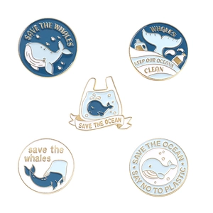 5-piece set of ocean whale enamel pins featuring environmental themes on a white background
