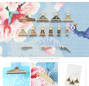 Macro detail of various stainless steel diamond painting pen nibs and clear storage case
