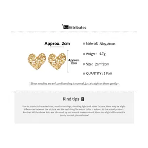 Detailed size chart for golden hollow heart earrings with alloy and zircon material