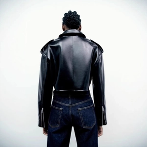 Back view of a minimalist black cropped leather jacket with a stylish loose-fit design