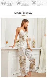 Detail of silk satin pajamas set with floral patterns and washing instructions icons