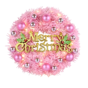Pink Christmas wreath with LED lights, silver baubles, and gold Merry Christmas sign