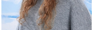 Close-up of grey winter knitted beanie featuring warm vertical ribbed texture details